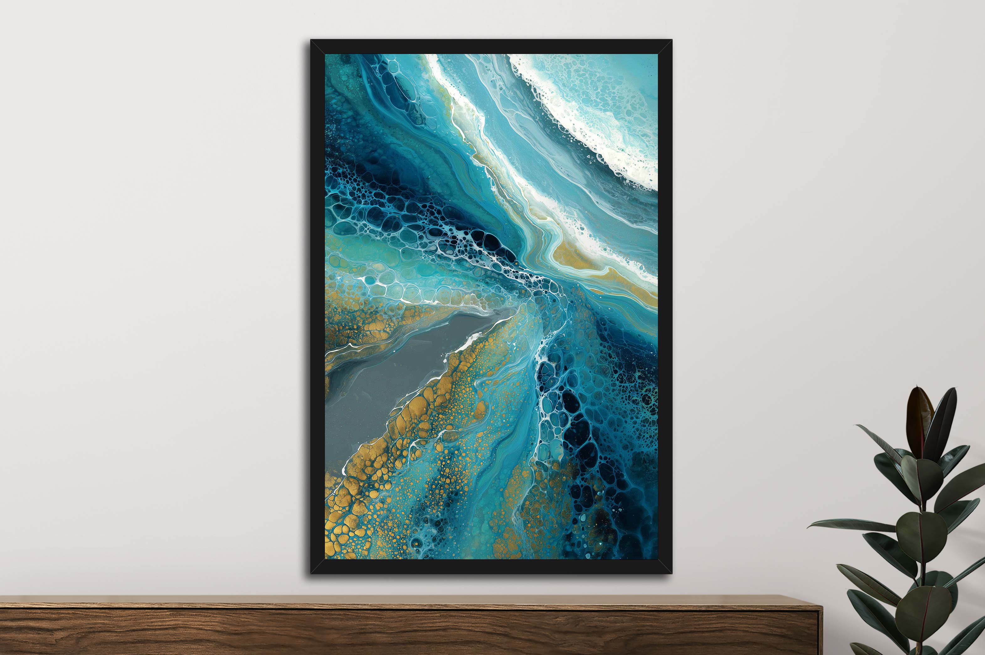 Framed abstract art with blue, green, and gold colors on a white wall.